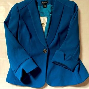 Blue medium sized blazer. Extra shoulder padding. 3/4 length sleeve